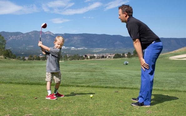 Garrett Froggatte instructing a young child
